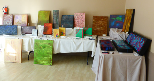 CAC various paintings on tables